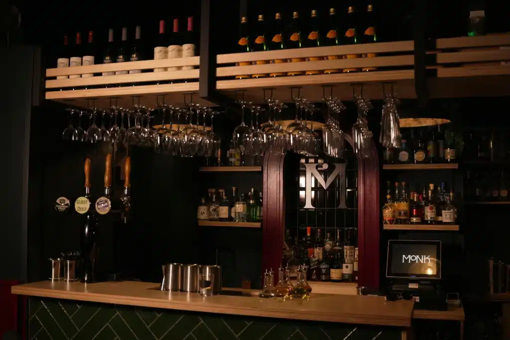Modern craft beer bar interior with elegant setup, featuring wine bottles. Beer Festival